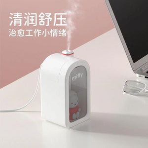 Miffy rabbit doll humidifier on desk beside computer monitor, white and pink minimalist design