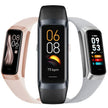 Three smart fitness trackers with color displays and silicone bands in black, pink, and silver