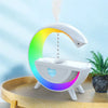 Modern rainbow LED humidifier on wooden tray with plant, heart-shaped cutout design