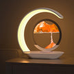 Modern LED table lamp with sand art centerpiece on a nightstand