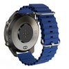Smartwatch back view with blue silicone strap, optical heart rate sensor, and metal case