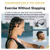 Woman jogging outdoors wearing black bone conduction headphones, fitness wearable, engineering design