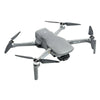 Gray DJI Mini SE drone with four propellers on white background