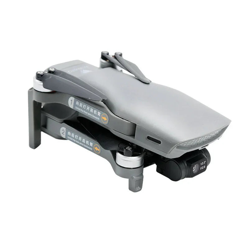 Folded gray camera drone with compact design and visible propeller arms