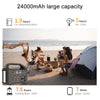 Portable power station on beach with group camping, tent, and 24000mAh battery capacity info