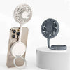 Portable mini phone fan with stand in white and gray, attached to smartphone and displayed on platform