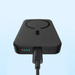Black Baseus wireless power bank with charging cable and LED indicators on light blue background