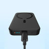 Black Baseus wireless power bank with charging cable and LED indicators on light blue background