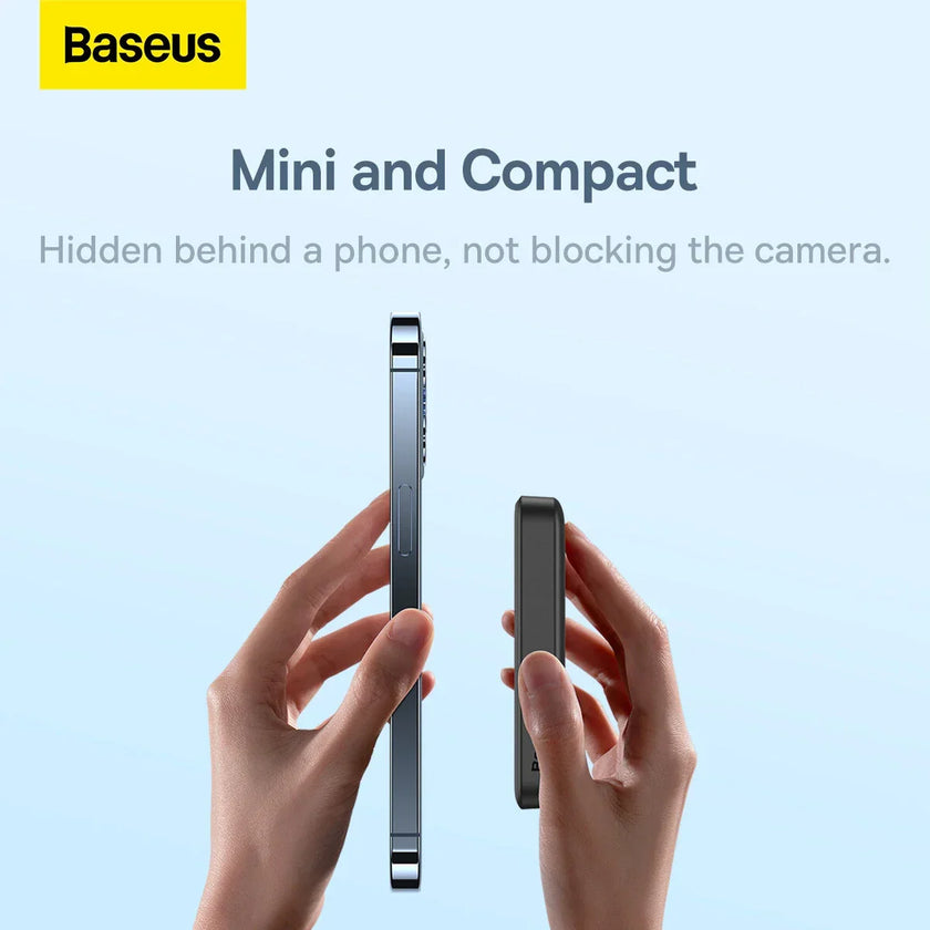 Hands holding a Baseus mini and compact phone accessory next to a smartphone against blue background.