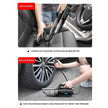 Person using portable car vacuum cleaner on seat and inflating car tire with same device