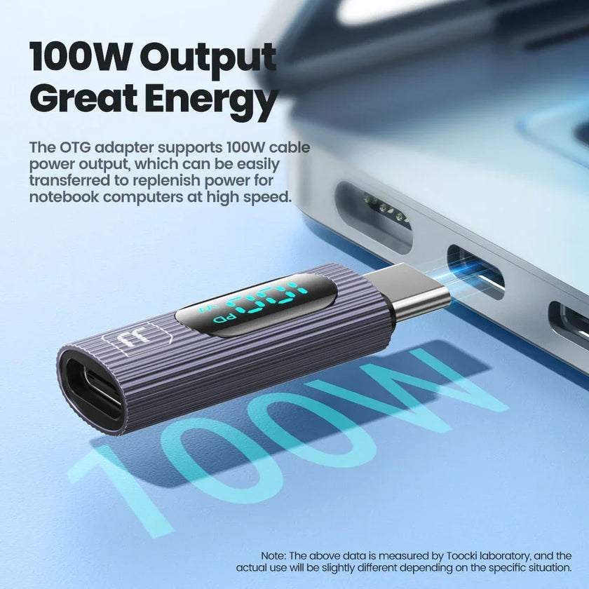 100W USB-C adapter with digital display connecting to a laptop port, fast charging accessory