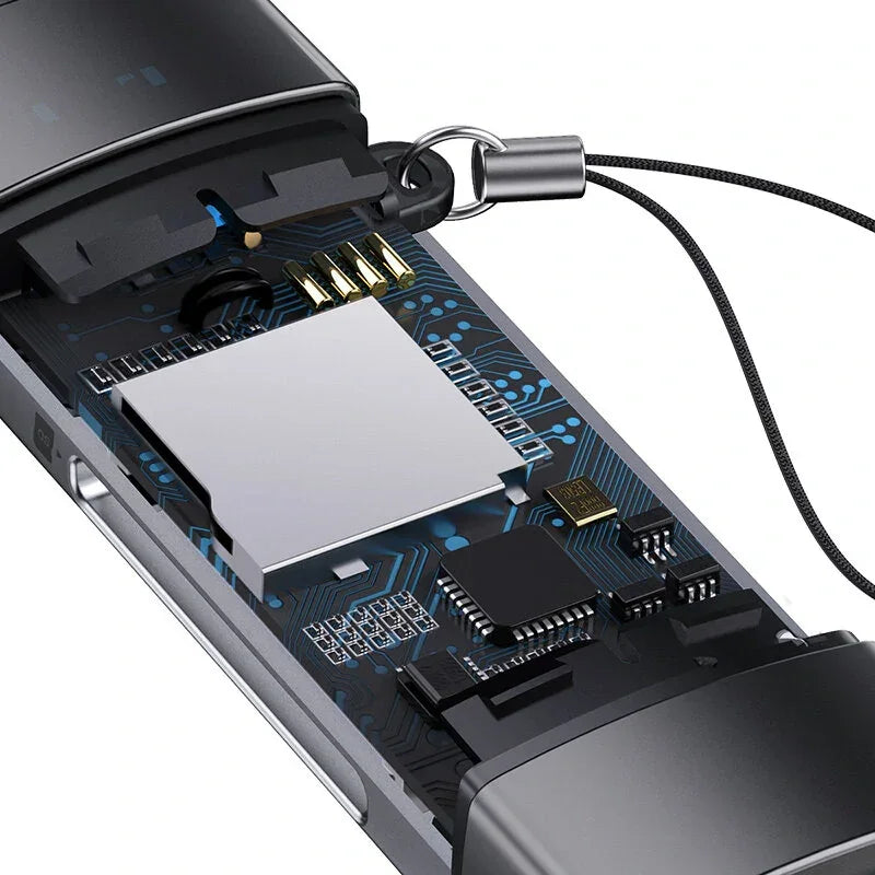 Close-up of exposed USB flash drive circuit board with microchips and keychain loop