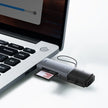 USB card reader with 64GB memory card plugged into a laptop USB port