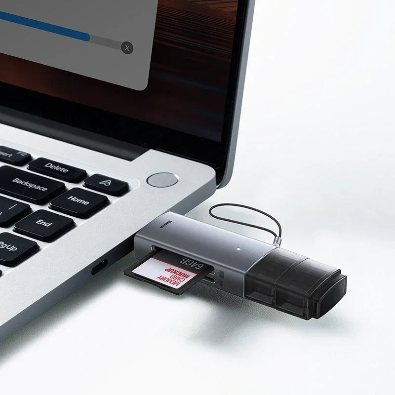 USB card reader with 64GB memory card plugged into a laptop USB port