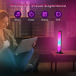Woman using laptop near LED ambient light bar, colorful room decor for music and gaming