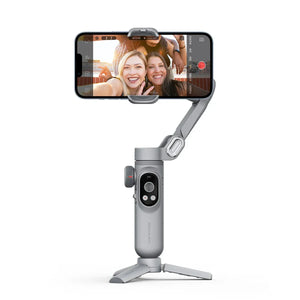 Smartphone gimbal stabilizer holding phone with two women taking a selfie, white background