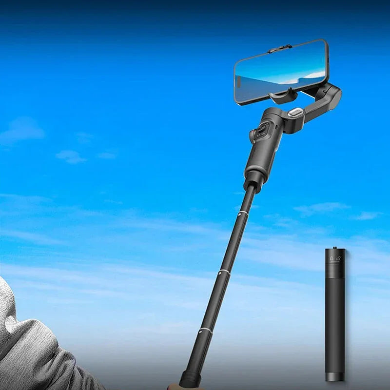 Selfie stick tripod with smartphone against blue sky background