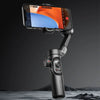 Smartphone mounted on a black handheld gimbal stabilizer with control buttons