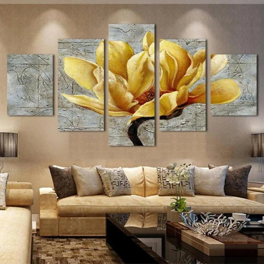 Modern living room with beige sofas, yellow flower canvas wall art, and decorative pillows