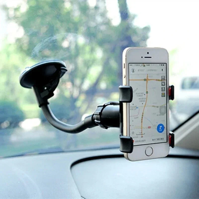 Car dashboard phone holder with smartphone displaying map navigation app