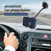 Windshield car phone holder with GPS navigation, mounted on dashboard in moving vehicle