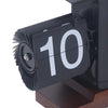 Close-up of a retro flip clock displaying the number 10 on black cards with white numbers.