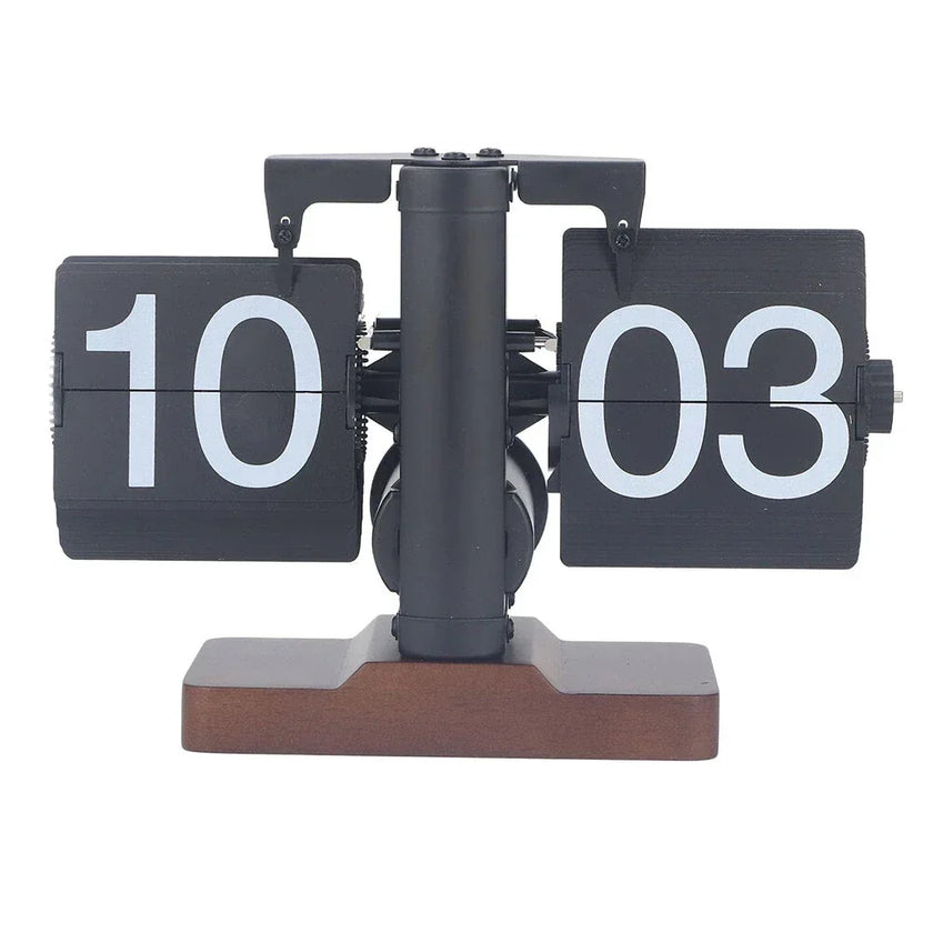 Retro flip clock with black cards, white numbers, and brown wood base on white background