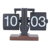 Retro flip clock with black cards, white numbers, and brown wood base on white background