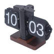 Retro flip clock with black and white cards on a wooden base, displaying 10:03