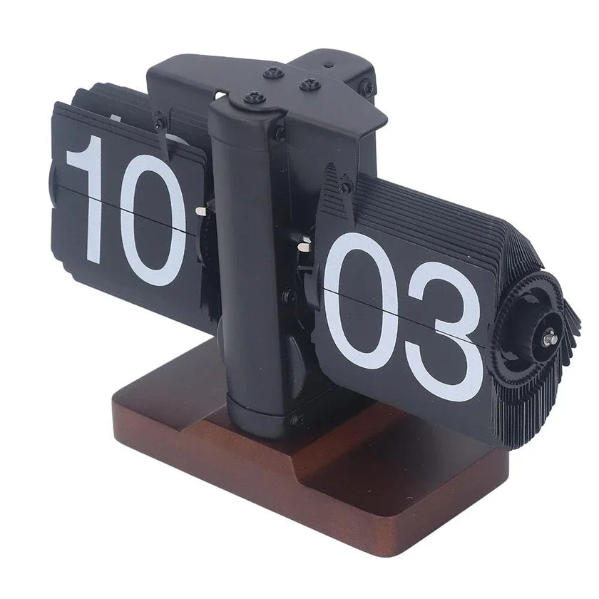 Retro flip clock with black and white cards on a wooden base, displaying 10:03