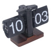 Retro flip clock with black and white numerals on a wooden base, modern desk clock